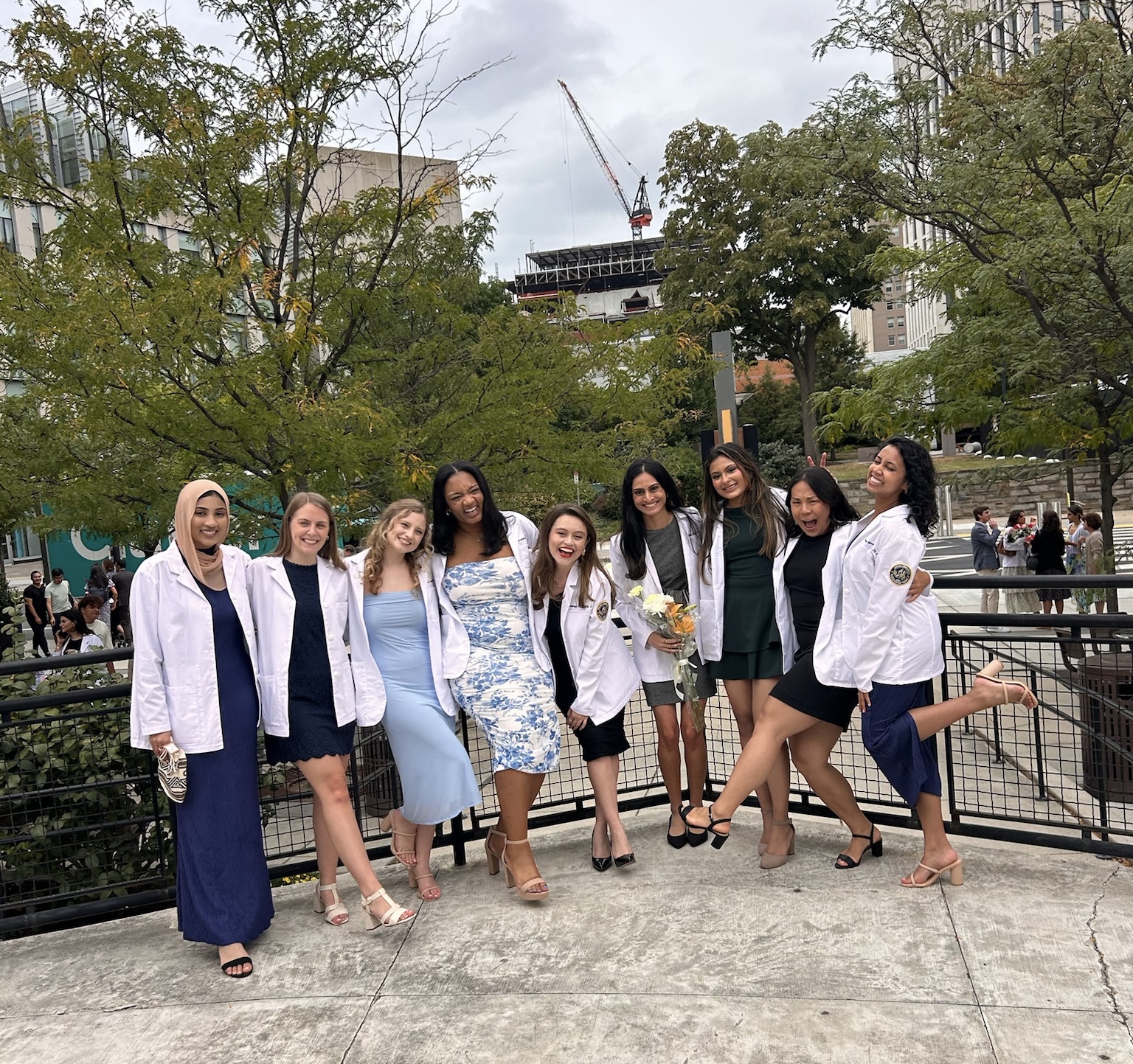 Hannah Brown and PA students wearing white coats